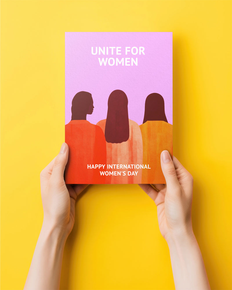 Flyer with 'Unite for Women' text and silhouette design held against a yellow background