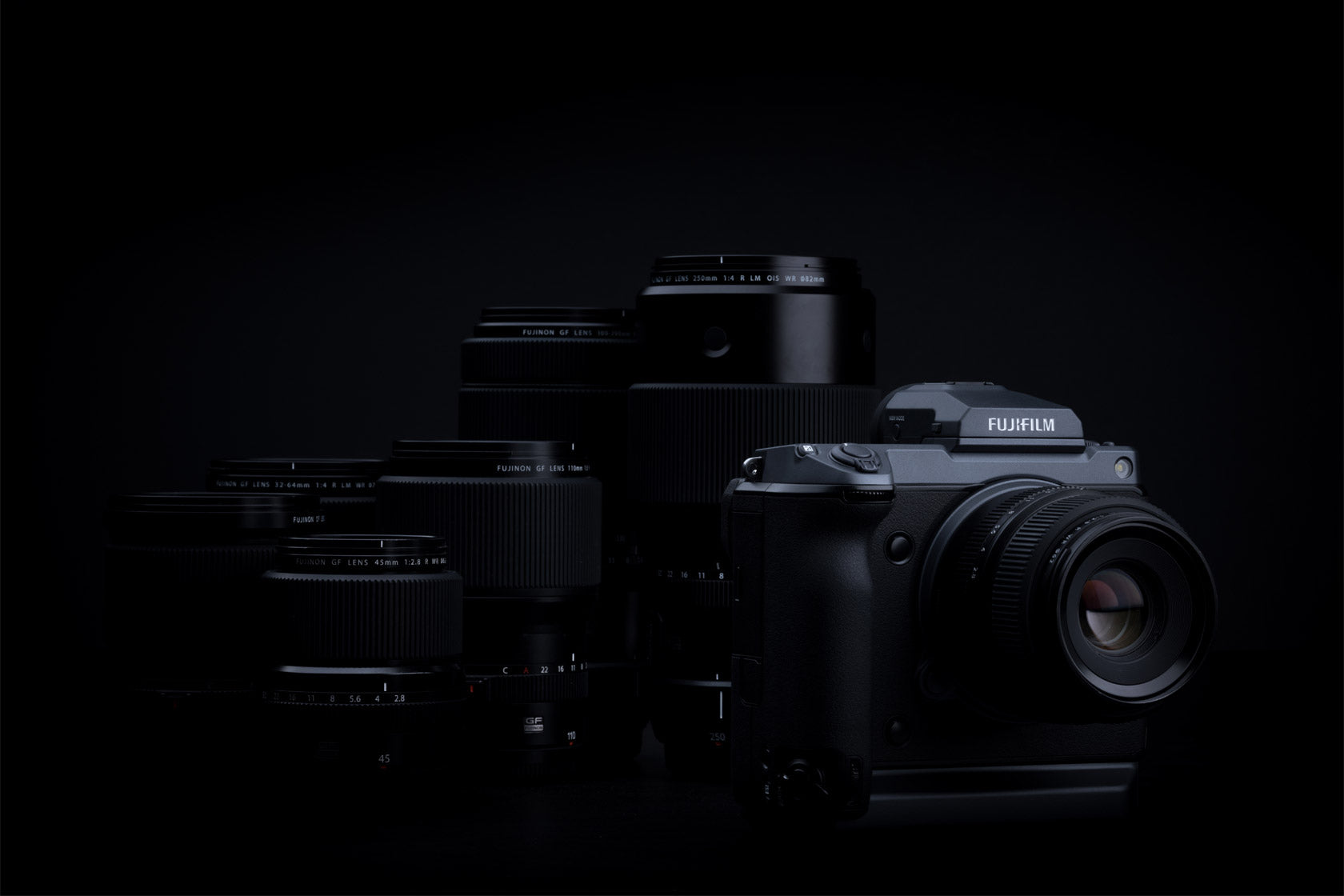 Fujifilm camera with lenses on a black background